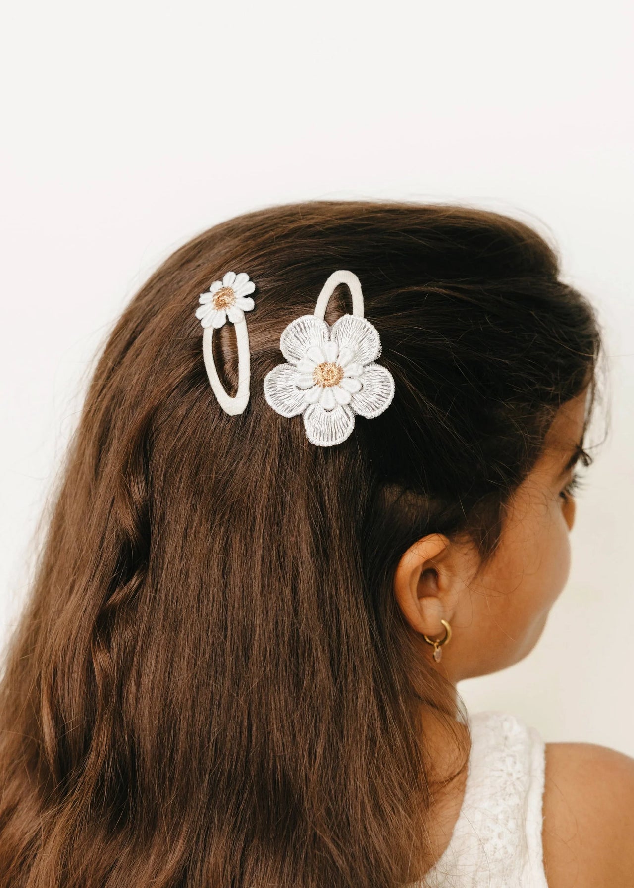 Mrs. Ertha sada sponek s kopretinami